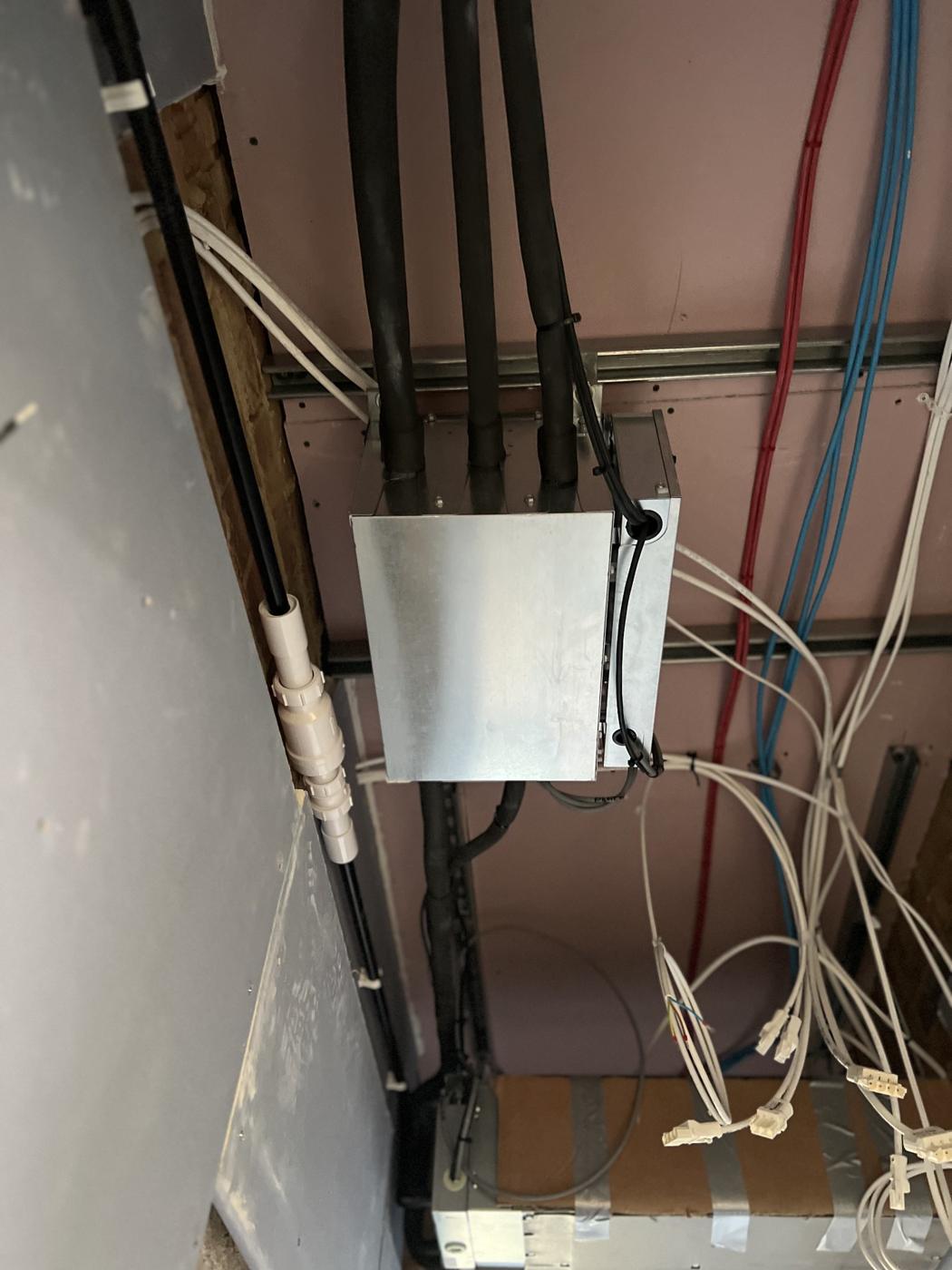 Branch box with insulated refrigerant pipework in a ceiling void
