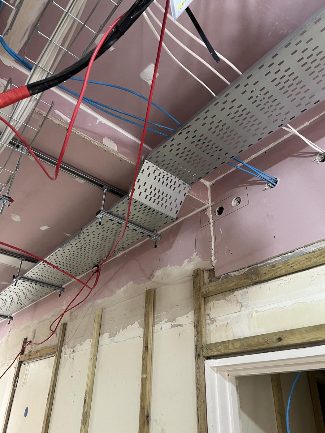 High level containment run along a corridor during a fit out