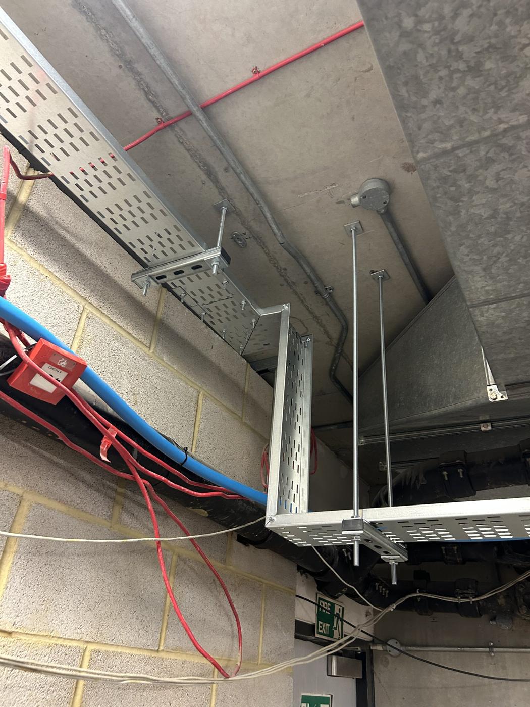 Containment routed around services in a plant area