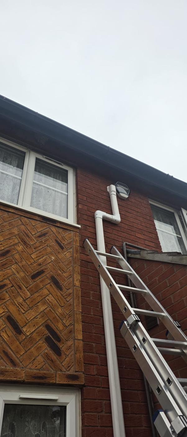 Trunking taken up to first floor level and offset around the alarm box