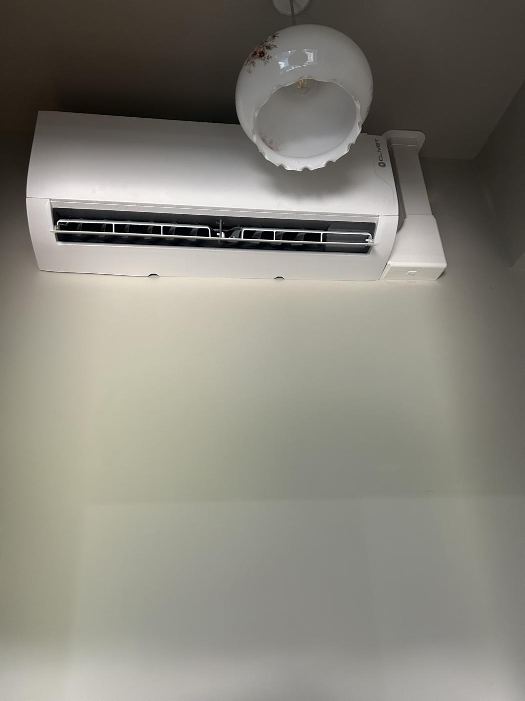 Wall mounted indoor unit in a top floor bedroom
